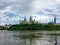 An amazing view of parliament hill surrounded by green forest and chateau laurier from the perspective of a tour boat