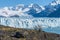 Amazing view of Perito Moreno glacier, blue ice burg glacier from peak of the mountain through the aqua blue lake in Los Glaciares