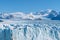 Amazing view of Perito Moreno glacier, blue ice burg glacier from peak of the mountain through the aqua blue lake in Los Glaciares