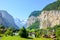 Amazing view of picturesque Lauterbrunnen village with famous Staubbach Falls in background. Popular tourist destination in