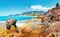 Amazing view on rocky tropical beach on sunny summer day in Alanya, Turkey. Turkish seascape with mountains and rocks