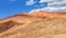 Amazing view of sandy desert at high Atlas mountains range. Moroccan landscapes with bright sun and clear blue sky. View