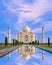 Amazing view on the Taj Mahal in sunset light with reflection in water. The Taj Mahal is an ivory-white marble mausoleum on the