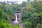 Amazing view of a waterfall covered with green trees all around, Bali Tourism, Bali Nature