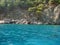 Amazing views from a pleasure yacht on the rocky coast of the Lycian Trail washed by the azure sea.