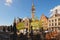 Amazing Wheat Market Dutch: Korenmarkt. Tower of old Post Office at the background.