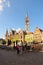 Amazing Wheat Market Dutch: Korenmarkt. Tower of old Post Office at the background.