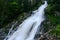 amazing white shining waterfall on vacation in austria mountains