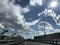 Amazing wild clouds on deep blue sky on the road