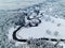 Amazing wild river in frozen forest. Really snowly winter on the north. Aerial panoramic view