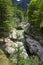 Amazing wild water in mala korita Soce valley, small pure clear turquoise flowing stream through stone gorge