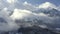Amazing winter landscape from drone snowy peak on cloudy sky background. Drone aerial shooting winter mountain covered snow and fo