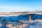 Amazing winter landscape near Kerid lake. The guy walks near the crater of the volcano Kerid in winter