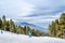 Amazing Winter Landscape with People Skiing and Snowboarding. Ski Piste on a Mountain in Basnko, South Bulgaria, Europe