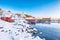 Amazing winter scenery of Moskenes village with ferryport and famous Moskenes parish Churc