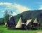 Amazing wooden cottages, green mountains and sky