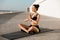 Amazing young sports woman make yoga exercises meditate outdoors on the beach.