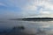 Amazingly beautiful early summer morning on the river, clouds reflected in the water surface