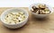 Amazon nuts and cashew nuts in ceramic bowl on wooden table