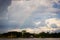 Amazon river jungle rainbow and clouds