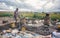 Ambatolampy, Madagascar - April 25, 2019: Unknown Malagasy man and woman working near simple fire oven, collecting scrap aluminium