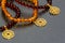 Amber bracelets with gold pendants.