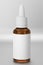 Amber colored pipette mockup. Amber bottle mockup for your design. 3d render