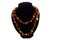 Amber double necklace on black velvet bust isolated on white background. Female accessories, decorative ornaments and jewelry.