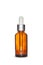 Amber dropper glass bottle on white background. Isolated and mockup