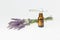 Amber essential lavender oil bottle. Pipette with drop and bottle on an isolated background.