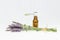 Amber essential lavender oil bottle. Pipette with drop and bottle on an isolated background.