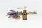 Amber essential lavender oil bottle. Pipette with drop and bottle on an isolated background.