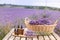 Amber essential lavender oil bottle. Violet lavendar field in Provence.