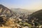 Amber Fort with golden sun light and green mountain as a background, Rajasthan, India