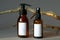 Amber glass bottles mockup with wooden branch. Pump bottle and sprayer with white blank labels. SPA natural organic cosmetics