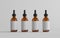 Amber Glass Dropper Bottle Mockup - Multiple Bottles. Blank Label. 3D Illustration