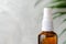 Amber glass spray bottle, close-up view. Natural organic cosmetic or herbal medicine product concept