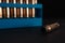 Amber gold empty bullet cases in blue holder