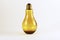 Amber light bulb bottle on white background.