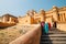 Amber Palace and woman with traditional Indian dress in Jaipur, India