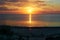 Amber sunset on the baltic sea. Calm sea, reflection of sun light in calm evening water. fiery sunset and calm clouds in the sky