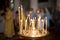 ambiance of church, candles and bokeh yellow lights