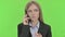 Ambitious Businesswoman Talking on Smartphone against Chroma Key