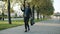 Ambitious entrepreneur walking in urban street jumping expressing happiness
