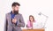 Ambitious lady. Sexy woman boss and male employee working together. Pretty woman looking at bearded man in office