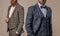 ambitious men in tuxedo menswear suits. men in tuxedo menswear isolated on grey.