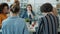 Ambitious women discussing business talking and gesturing sitting at desk in workplace