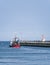 Amble harbour, Northumberland, Uk with pier and small fishing boat