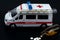 Ambulance car with thermometer and pills. Ambulance auto paramedic emergency