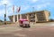 Ambulance in front of Dallas City Hall with American, Texas, and City of Dallas Flags